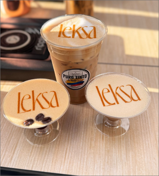 Assortment of Puro Tinto specialty iced and cocktail coffee drinks with 'leksa' logo latte art