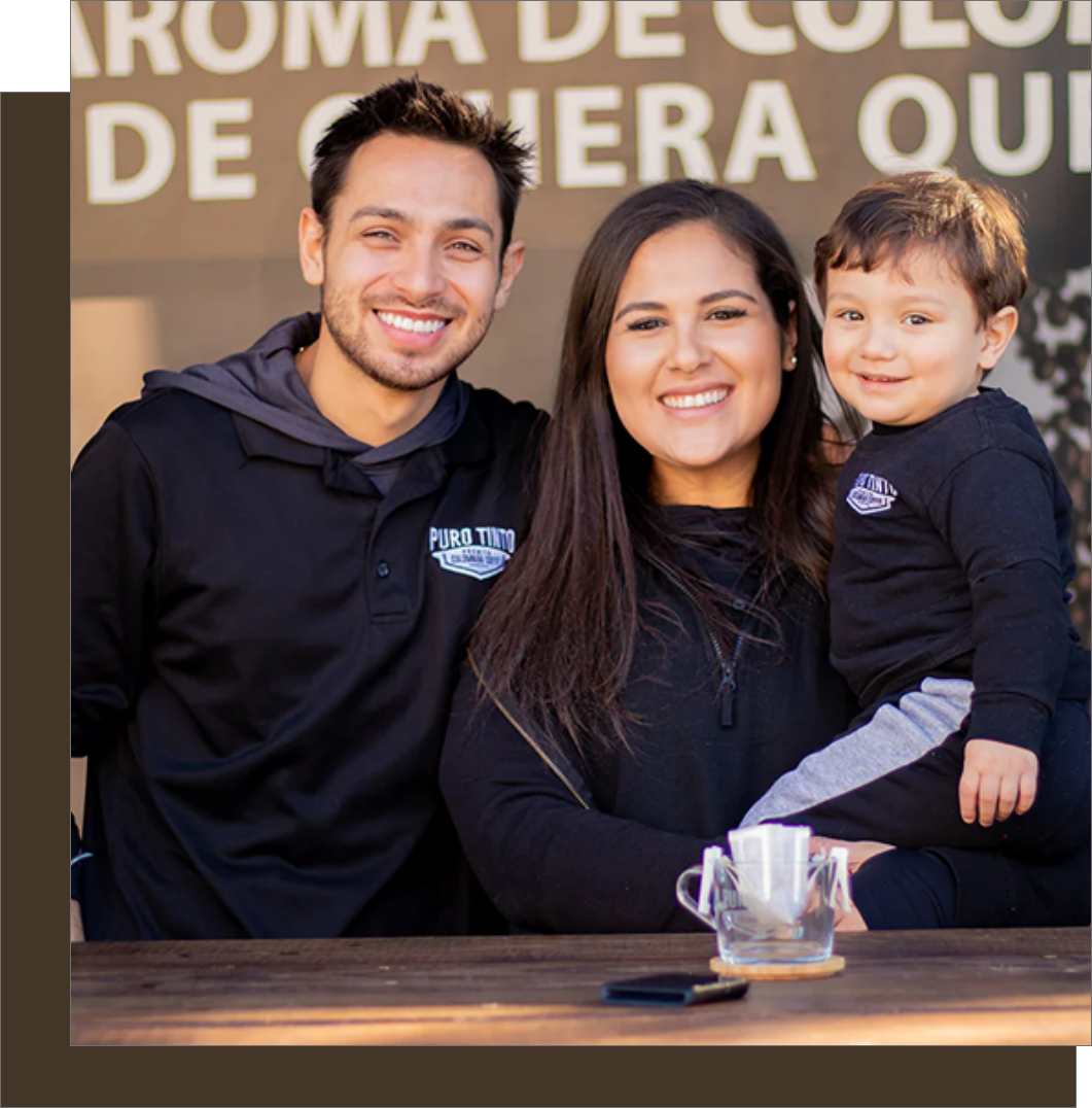 Puro Tinto Coffee founders and family proudly with their brand